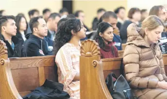  ?? ?? Some of more than 200 believers, mostly Filipinos, attend the English-language mass at Saint Blaise Catholic church in Zagreb, Croatia.