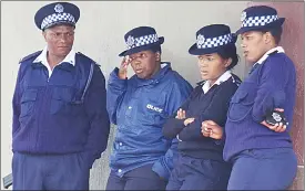  ?? (File pic) ?? Some police officers in this file pic. Parents say the presence of security forces in schools intimidate­s pupils.