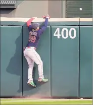  ?? Jonathan Daniel / Getty Images ?? Red Sox outfielder Alex Verdugo climbs the wall as a ball hit by Chicago’s Leury Garcia clears it in the ninth inning on Sunday in Chicago.