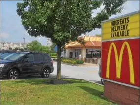  ?? MICHAEL SNEFF — DIGITAL FIRST MEDIA ?? The sign at the McDonald’s on South Trooper Road in Audubon lets customers know that it offers delivery through UberEATS. The chain has expanded its delivery in Montgomery and Chester counties.