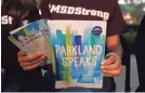  ?? BRYNN ANDERSON/AP ?? Leni Steinhardt, 16, reads from “Parkland Speaks: Survivors from Marjory Stoneman Douglas Share Their Stories.”