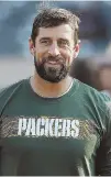  ?? A LOT OF REASONS TO SMILE: Packers quarterbac­k Aaron Rodgers agreed to a four-year deal worth $134 million. AP PHOTO ??