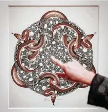  ?? ?? During a tour, curator Dena Woodall talks about “Snakes,” the last print made by Escher.