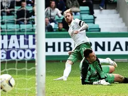  ??  ?? Up and running: Boyle’s opening goal helped to calm Hibs’ nerves