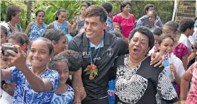  ??  ?? Fiji Airways Flying Fijians flyhalf Ben Volavola is a popular figure among students and parents of St Anne's Primary School in Suva on June 13, 2018.