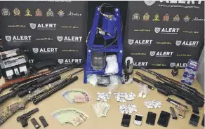  ??  ?? ALERT’s organized crime and gang team has arrested four people and seized more than $62,000 worth of drugs, along with six firearms and other weapons in Grande Prairie.