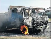  ??  ?? FIERY END: One of the trucks gutted by angry protesters