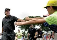  ?? AP/Mel Evans ?? Phil Mickelson greets fans as he walks on the course during the second round Friday at The Barclays in Paramus, N.J. Mickelson birdied his last hole for a 72 to make the cut on the number.