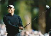  ?? MICHAEL OWENS/GETTY ?? Tiger Woods plays his shot from the second tee during the second round of the the Genesis Invitation­al on Friday at Riviera Country Club in Pacific Palisades, California.