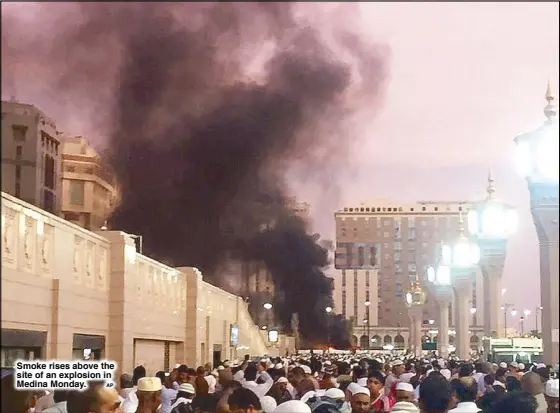  ?? AP ?? Smoke rises above the site of an explosion in Medina Monday.