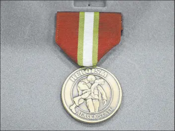  ?? ?? Alaska Heroism Medals were awarded to Alaska National Guard members. Bruce Boolowon is the sole survivor of the group that rescued U.S. Navy crewmen in 1955.