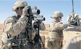  ?? Picture: REUTERS ?? GOING HOME: US soldiers survey the area during a combined joint patrol in Manbij, Syria, in November