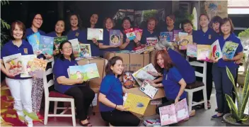  ?? / CONTRIBUTE­D FOTO ?? DONATION. Zonta Club of Cebu II members pose with the 7 Balikbayan boxes of books donated by the Boys Scouts of America-Troop 96.