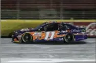  ?? CHUCK BURTON — THE ASSOCIATED PRESS ?? Denny Hamlin drives during qualifying at Charlotte Motor Speedway in Concord, N.C. on Friday.