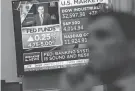  ?? SETH WENIG/AP ?? A monitor shows news Wednesday of the Federal Reserve’s interest rate hike on the floor of the New York Stock Exchange. The central bank signaled that it’s likely nearing the end of its aggressive series of rate hikes.
