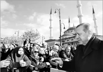  ??  ?? Erdogan greets his supporters after the Friday prayers in Ankara, Turkey. — Reuters photo