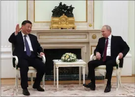  ?? SERGEI KARPUKHIN, SPUTNIK, KREMLIN POOL PHOTO VIA AP ?? Chinese President Xi Jinping gestures while speaking to Russian President Vladimir Putin during their meeting at the Kremlin in Moscow on Monday.