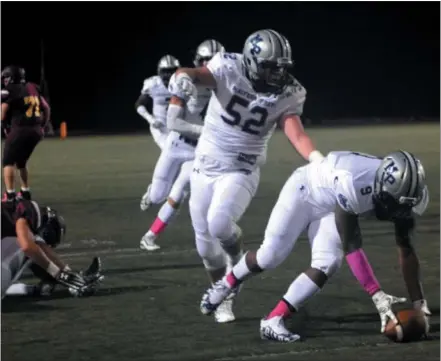  ?? BILL RUDICK - FOR DIGITAL FIRST MEDIA ?? Domir Brown picks up a fumble for Malvern Prep during Friday’s 35-7 victory against Avon Grove on Friday.