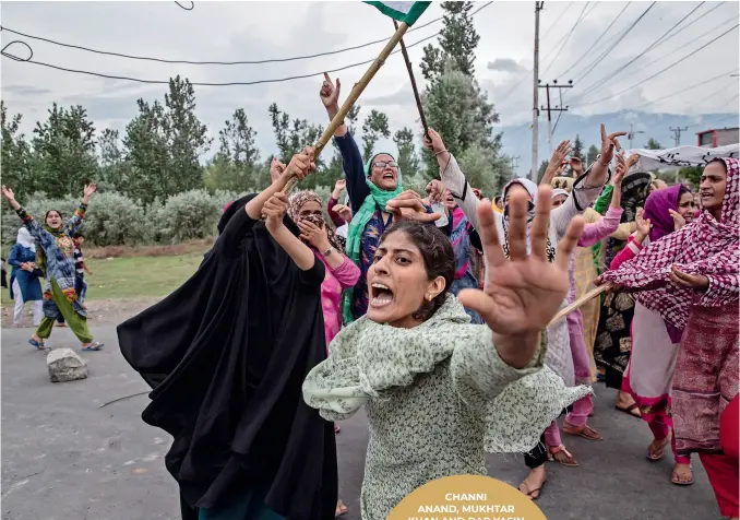  ??  ?? Women shout slogans as Indian policemen fire teargas and live ammunition in the air to stop a protest march in Srinagar, Indian controlled Kashmir. (Photo by Dar Yasin/ap)