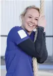  ?? — AFP ?? Anouk Garnier celebrates breaking the rope climbing world record after her rope climb up to the second floor of the Eiffel Tower in Paris.