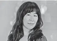  ?? ANDRIA LO ?? “The Last Story of Mina Lee” author Nancy Jooyoun Kim says walking around a new city is a great way to get acclimated to the culture there.