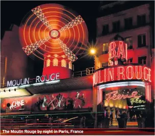  ??  ?? The Moulin Rouge by night in Paris, France