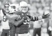  ?? ROSS D. FRANKLIN/AP ?? J.J. Watt celebrates Sunday during the Cardinals’ 31-5 victory over the Texans, his former team.