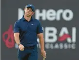  ?? KAMRAN JEBREILI/AP ?? Rory McIlroy reacts after missing a ball on the 18th during the second round of the Dubai Desert Classic on Saturday in Dubai, United Arab Emirates.