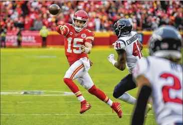  ??  ?? Chiefs quarterbac­k Patrick Mahomes’ primary stats may have dropped this season, to 4,031 yards and 26 TDs, but other indicators hint at subtle improvemen­t. He sliced his intercepti­on rate in half. He took about a half-sack fewer per game.