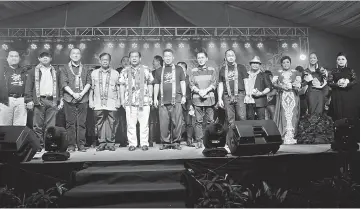  ??  ?? Ugak (fifth left) and Jamit on his right on stage, ready to present souvenirs to all semi-finalists of ACSJ 2017. With them, from Jamit’s left, are Joseph Belayong, Philimon Nuing and Galong Luang.