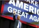  ?? ASSOCIATED PRESS PHOTO ?? Republican presidenti­al candidate, businessma­n Donald Trump waves has he arrives for a campaign rally Monday in Manchester, N.H. Trump easily won the GOP primary on Tuesday.