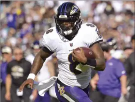  ?? AP file photo ?? Lamar Jackson’s new deal with the Baltimore Ravens makes the star quarterbac­k the highest-paid player in NFL history.
