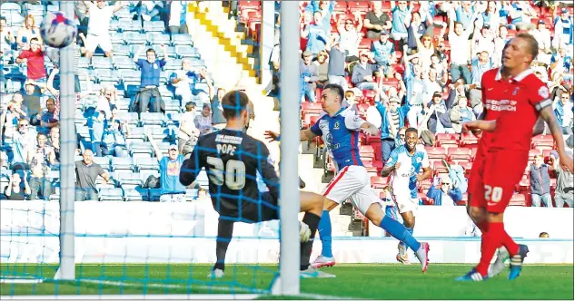  ?? PICTURES: Action Images ?? THREE ‘N EASY: Tom Lawrence wraps up the victory for Blackburn Rovers with his side’s third goal