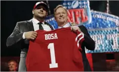  ?? MARK HUMPHREY — THE ASSOCIATED PRESS ?? Ohio State defensive end Nick Bosa poses with NFL Commission­er Roger Goodell after the San Francisco 49ers selected Bosa in the first round at the NFL draft in April of 2019, in Nashville, Tenn.