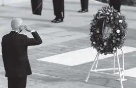  ?? ALEX BRANDON AP ?? President Joe Biden salutes before placing a wreath during a centennial ceremony for the Tomb of the Unknown Soldier in Arlington National Cemetery on Thursday.