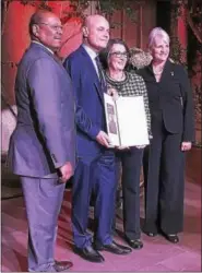  ?? BRIAN MCCULLOUGH/DIGITAL FIRST MEDIA ?? Bob Hankin, center left, displays his Executive of the Year award at the Chester County Chamber of Business & Industry’s annual dinner held Thursday at Longwood Gardens. Shown with him are state Reps. Harry Lewis, Becky Corbin and Carolyn Commita.