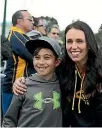  ?? PHOTO: DAVID WHITE/STUFF ?? New Labour leader Jacinda Ardern isn’t short of people wanting to have their photo taken with her. She couldn’t escape the attention on Saturday while she was watching the Mt Albert Rugby League team win against Te Atatu.