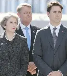  ?? — GETTY IMAGES FILES ?? British PM Theresa May, Romanian President Klaus Werner Iohannis and Canadian PM Justin Trudeau. May meets with Trudeau this week.