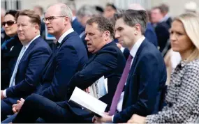  ??  ?? Remembranc­e: Barry Cowen, centre, with other ministers at yesterday’s commemorat­ion ceremony at Collins Barracks