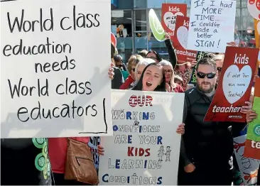  ?? SCOTT HAMMOND/ STUFF ?? Teachers on strike march through central Blenheim in August.