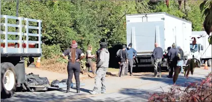  ?? Olivia Morley ?? Crew members take down the set and load equipment onto trucks after “Stranger Things” filming wraps for Wednesday. The crews will be in town until Friday for filming at the Claremont House. Part of Second Avenue will be closed as filming continues.