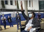  ?? JOHN WALKER — THE FRESNO BEE ?? Karen Parker-Bryant, 64, raises a hand skyward after she was released from a hospital in Fresno after a battle with COVID-19.
