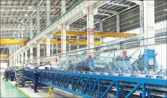  ?? PROVIDED TO CHINA DAILY ?? Employees work at an Otis manufactur­ing facility in Guangzhou, Guangdong province, in September 2018.