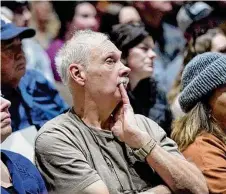  ?? Matt Freed/AP ?? Residents listen during a town hall meeting last week at East Palestine High School concerning the Feb. 3 Norfolk Southern freight train derailment in East Palestine, Ohio.