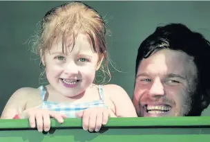  ??  ?? Emelia Groves, four, is ready to enter the pool from the changing room with dad Steven