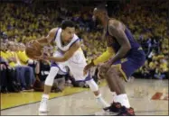  ?? BEN MARGOT — THE ASSOCIATED PRESS FILE ?? In this June 14, 2015 photo, Golden State Warriors guard Stephen Curry, left, is guarded by Cleveland Cavaliers forward LeBron James during the second half of Game 5 of basketball’s NBA Finals in Oakland.