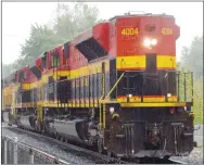  ?? Westside Eagle Observer/MIKE ECKELS ?? A different sight rolls through Decatur May 12 as a pair of SD 70 locomotive­s belonging to Kansas City Southern Railroad and a Union Pacific GP 50 deadhead back to parts unknown May 12. What is unusual about this trio is that the lead locomotive is running what is called “long nose,” meaning the engine part is running ahead of the cab and in reverse.