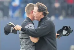  ?? AFP ?? Phil Mickelson, right, and Henrik Stenson at the end of the final round.