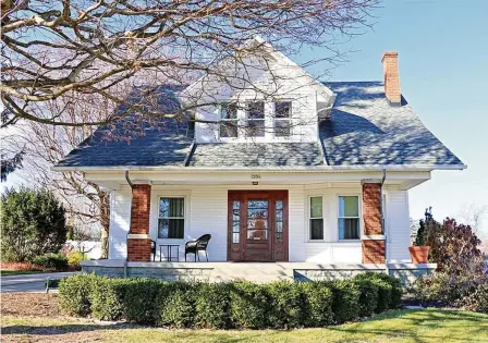  ?? KATHY TYLER / CONTRIBUTE­D ?? Listed for $299,986, the vinyl-sided home at 1206 S. Detroit St. in Xenia offers about 1,728 square feet of living space.