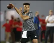  ?? PAUL VERNON — THE ASSOCIATED PRESS FILE ?? Ohio State quarterbac­k Justin Fields throws during an NFL Pro Day at Ohio State University in Columbus, Ohio on March 30.